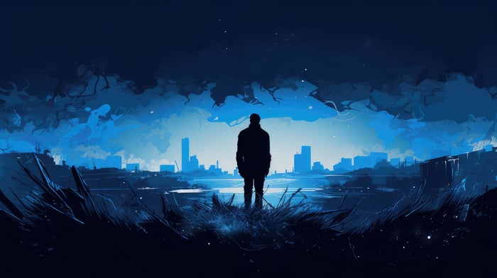 Man standing in front of a city skyline at night