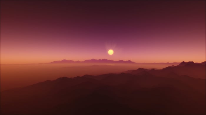 Sunrise over misty mountains