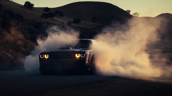 Dodge Challenger drifting in smoke