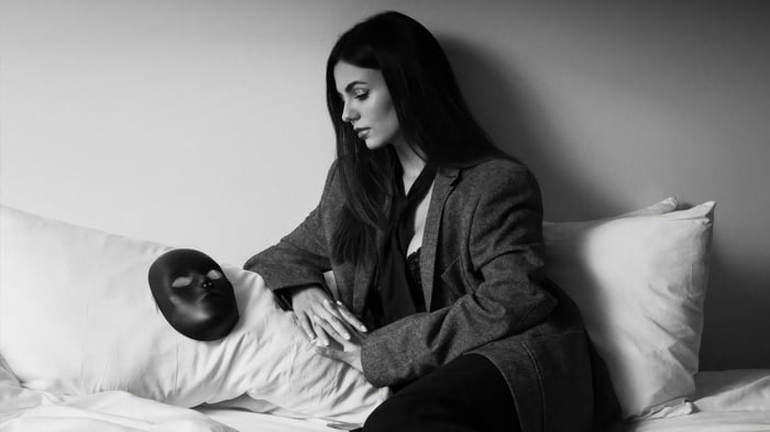 Victoria Justice with a mask on a pillow