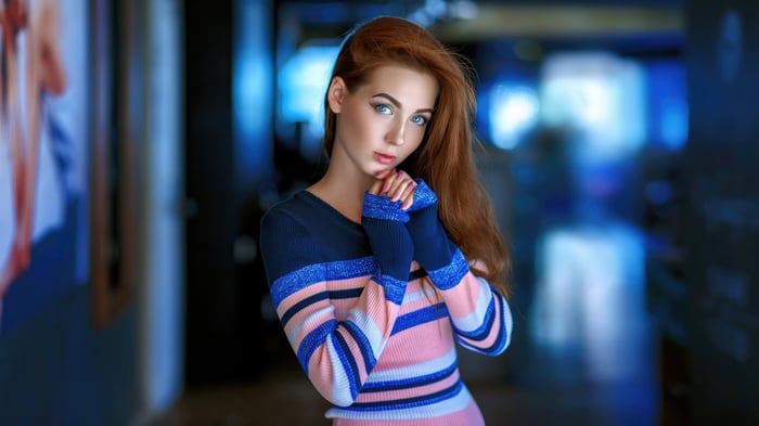 Young woman with red hair and blue eyes