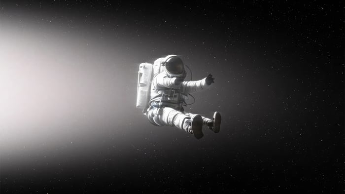Astronaut floating in space with stars
