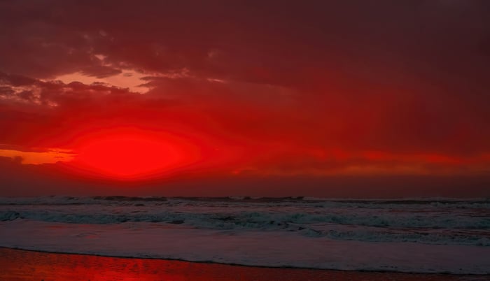 Red sunset over the sea with waves