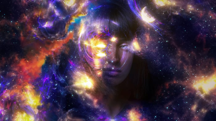 Girl's face merging with a cosmic nebula