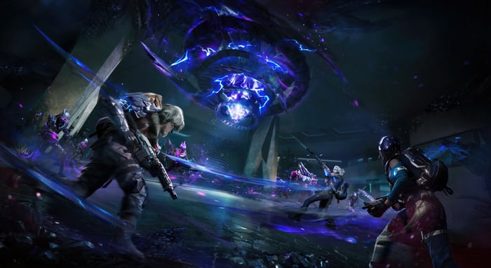 Guardians battle a large alien entity in a dark environment