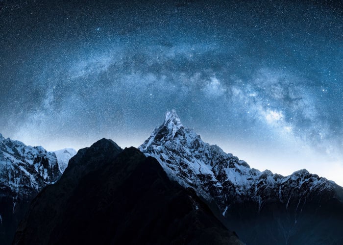 Starry Night Over Snow-Capped Mountains