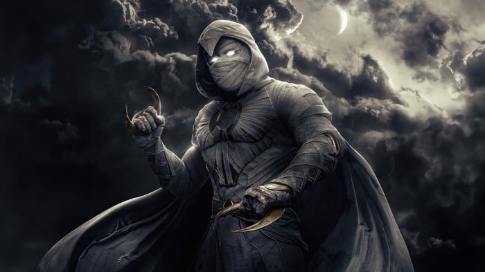 Moon Knight with Crescent Darts in Dark Sky