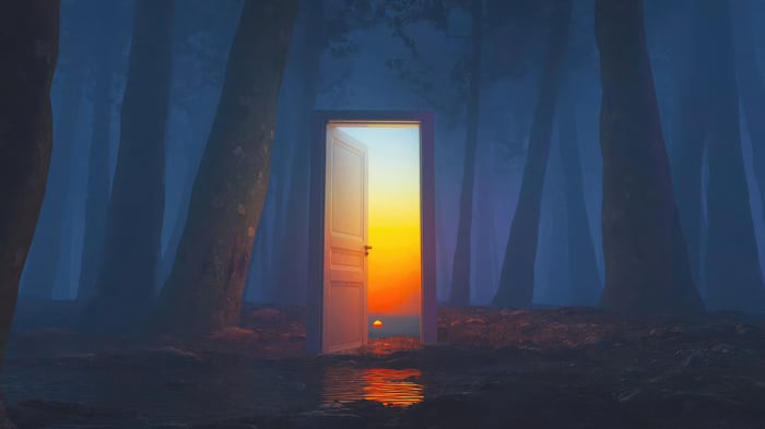 Doorway to a sunset in a misty forest