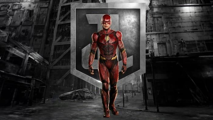 The Flash in front of the Justice League logo