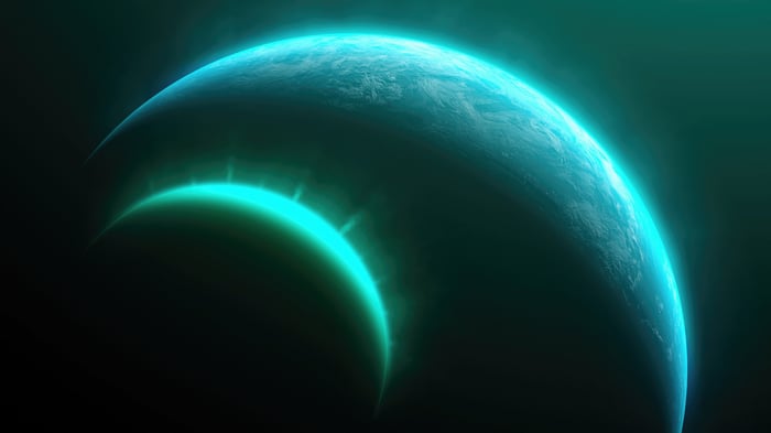 Two planets with glowing aurora in space