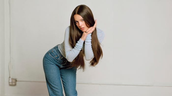 Olivia Rodrigo in blue jeans and a light blue top