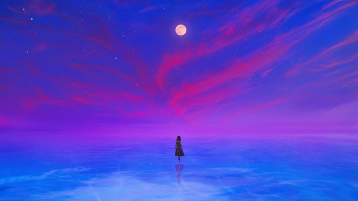 A lone figure stands in a surreal, glowing ocean under a cosmic sky.