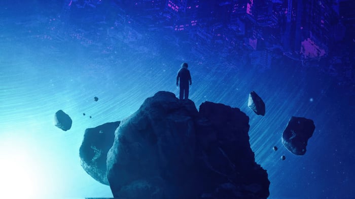 Person standing on a rock in space with floating asteroids