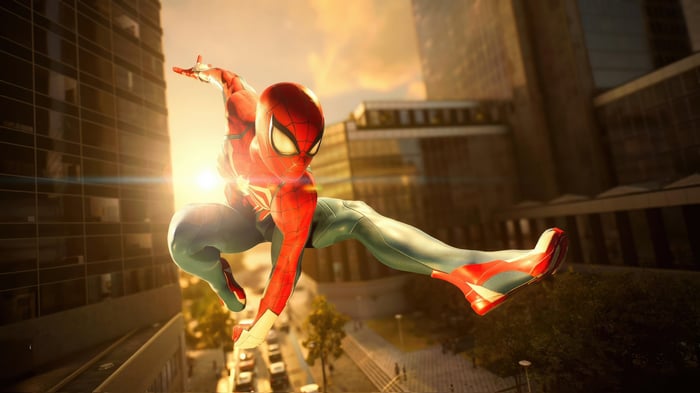Spider-Man swinging through a city at sunset
