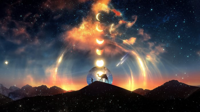 Man and camel on a hill under a cosmic sky