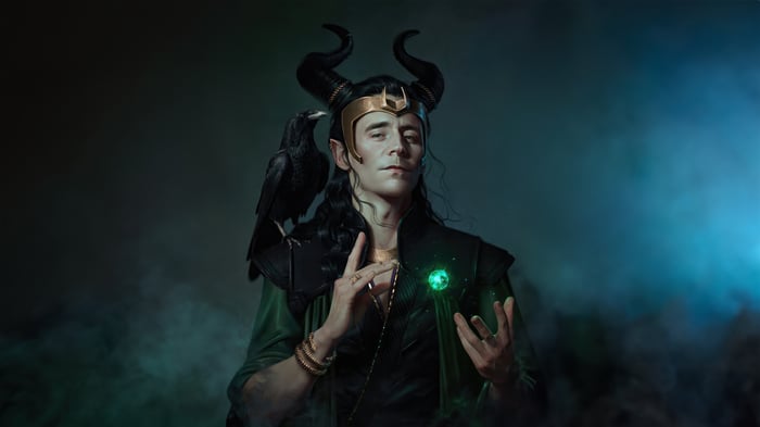 Loki with a raven and a glowing orb