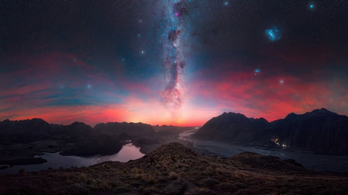 Milky Way over mountains and lake at sunset