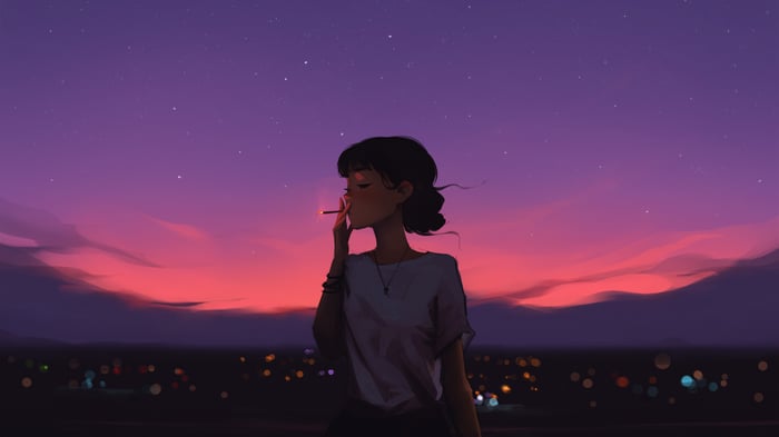 Girl smoking at sunset over city lights