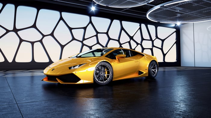 Yellow Lamborghini Huracan in a modern showroom
