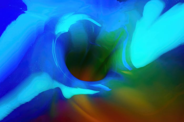 Abstract blue and green swirling vortex
