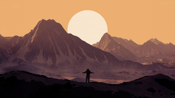 Astronaut standing on a rocky planet with mountains and a large sun