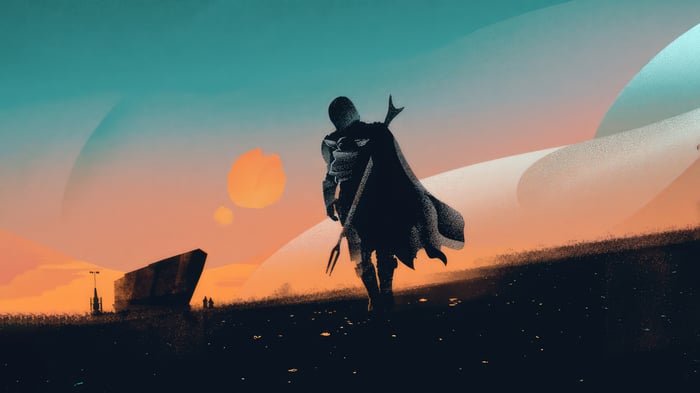 The Mandalorian walking on a desert planet