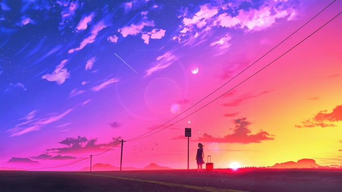 Girl with suitcase waiting at bus stop at sunset