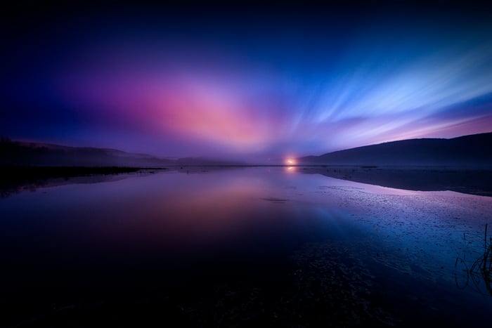 Body of water under dramatic sky