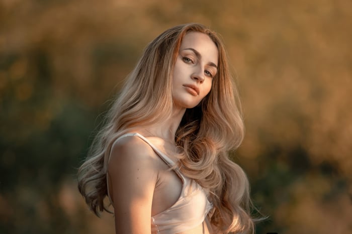 Blonde girl with wavy hair outdoors