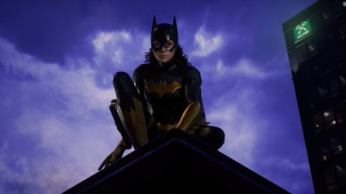 Batgirl perched on a rooftop in Gotham
