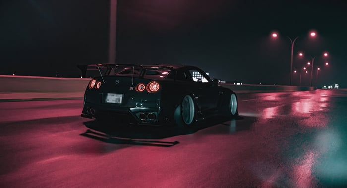 Nissan GTR on a wet road at night