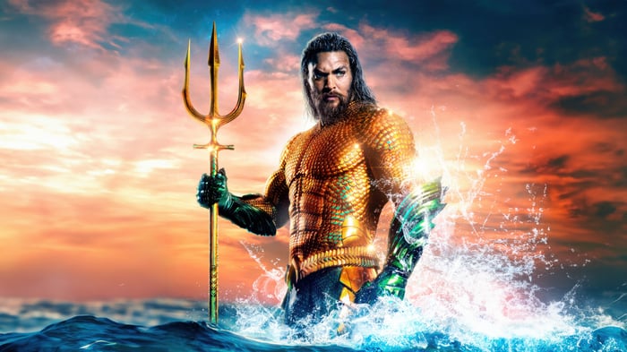 Aquaman holding a trident in the ocean