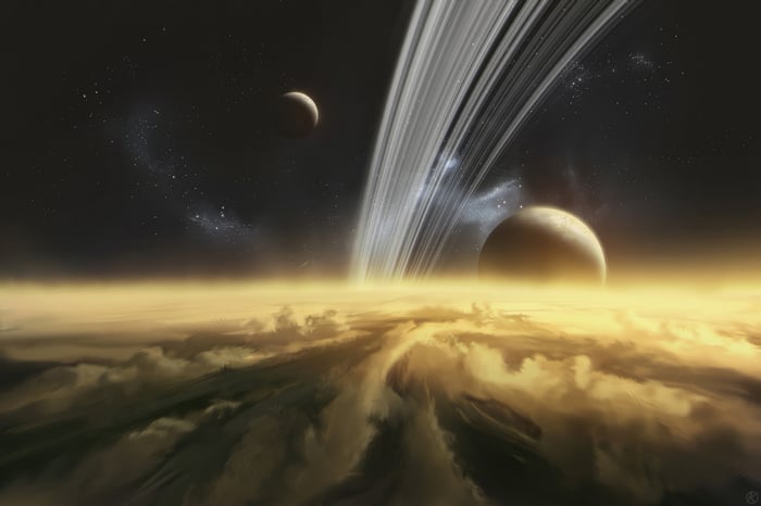 Planet with Rings and Moons Above Clouds