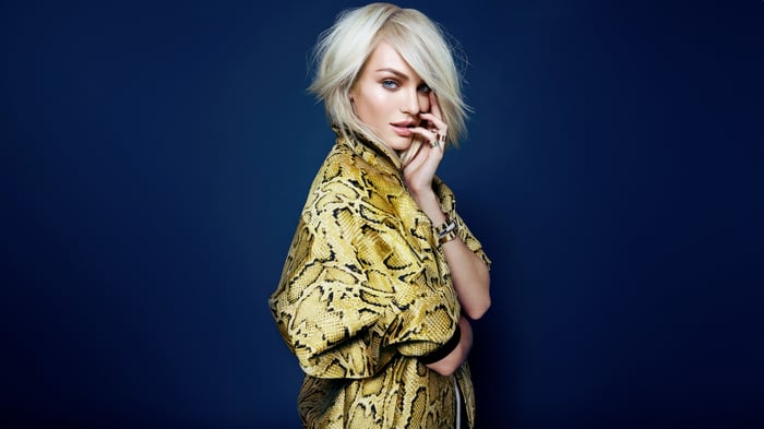 Candice Swanepoel in a yellow snakeskin jacket