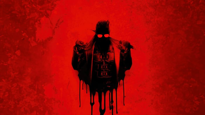 A dark figure with red eyes and a trench coat