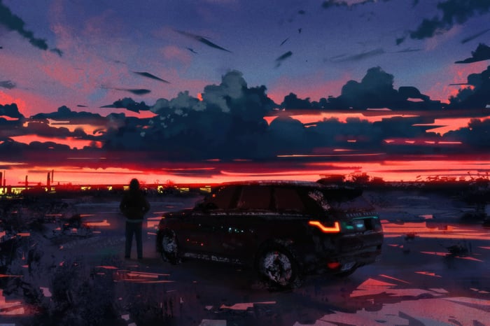 Range Rover at sunset with a person