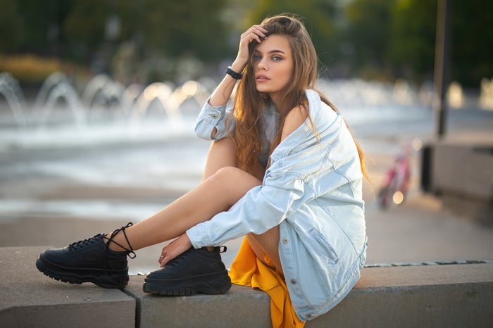 Girl in a denim jacket and yellow dress