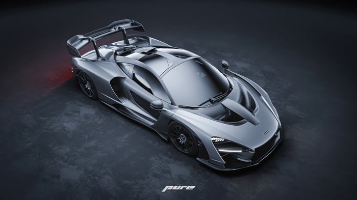 Silver McLaren Senna on a dark surface