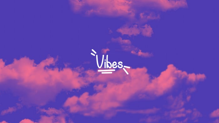 Vibes text on a purple and pink sky