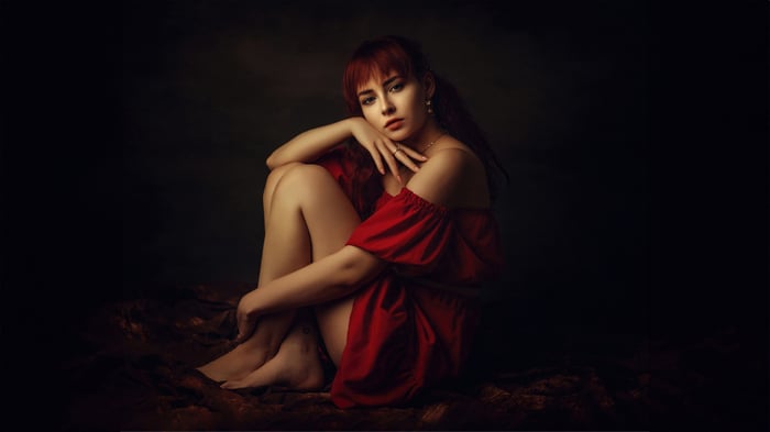 Woman in a red dress sitting