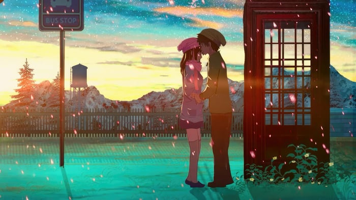 Couple kissing at a bus stop with falling petals