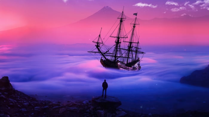 A ship sails through clouds with a mountain in the background