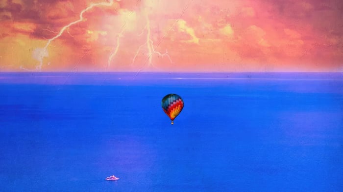 Hot air balloon over the ocean during a storm
