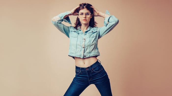 Alexandra Daddario in a denim jacket and jeans