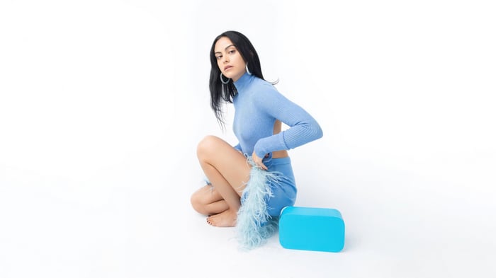 Camila Mendes in Blue Outfit with Feathers