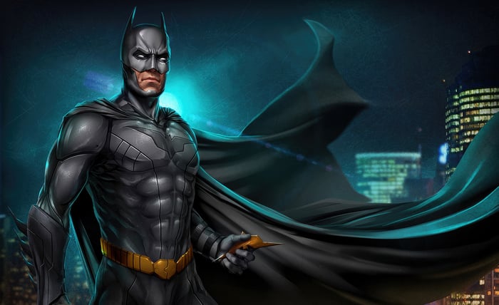 Batman standing in front of a city skyline