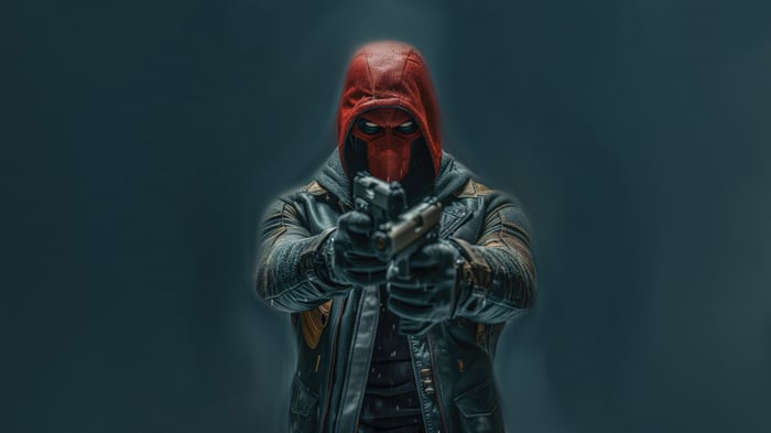 Red Hood aiming two pistols