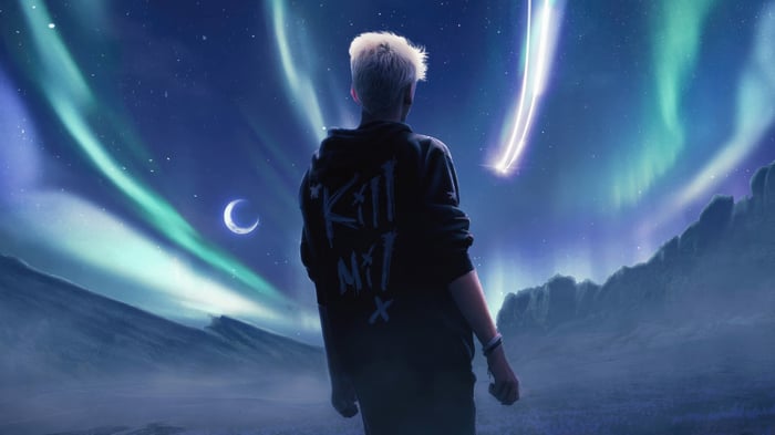 Person looking at Aurora Borealis and shooting star