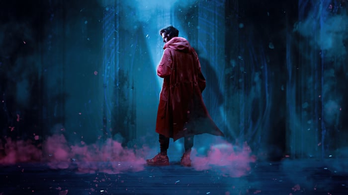 Doctor Strange in a red coat with pink smoke