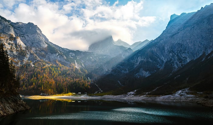 Sunbeams on Mountains over a Lake